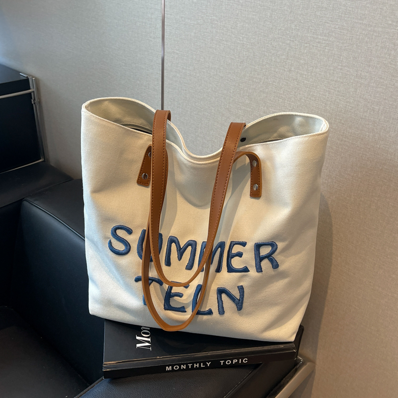 Casualruby © Embroidered letter canvas tote bag